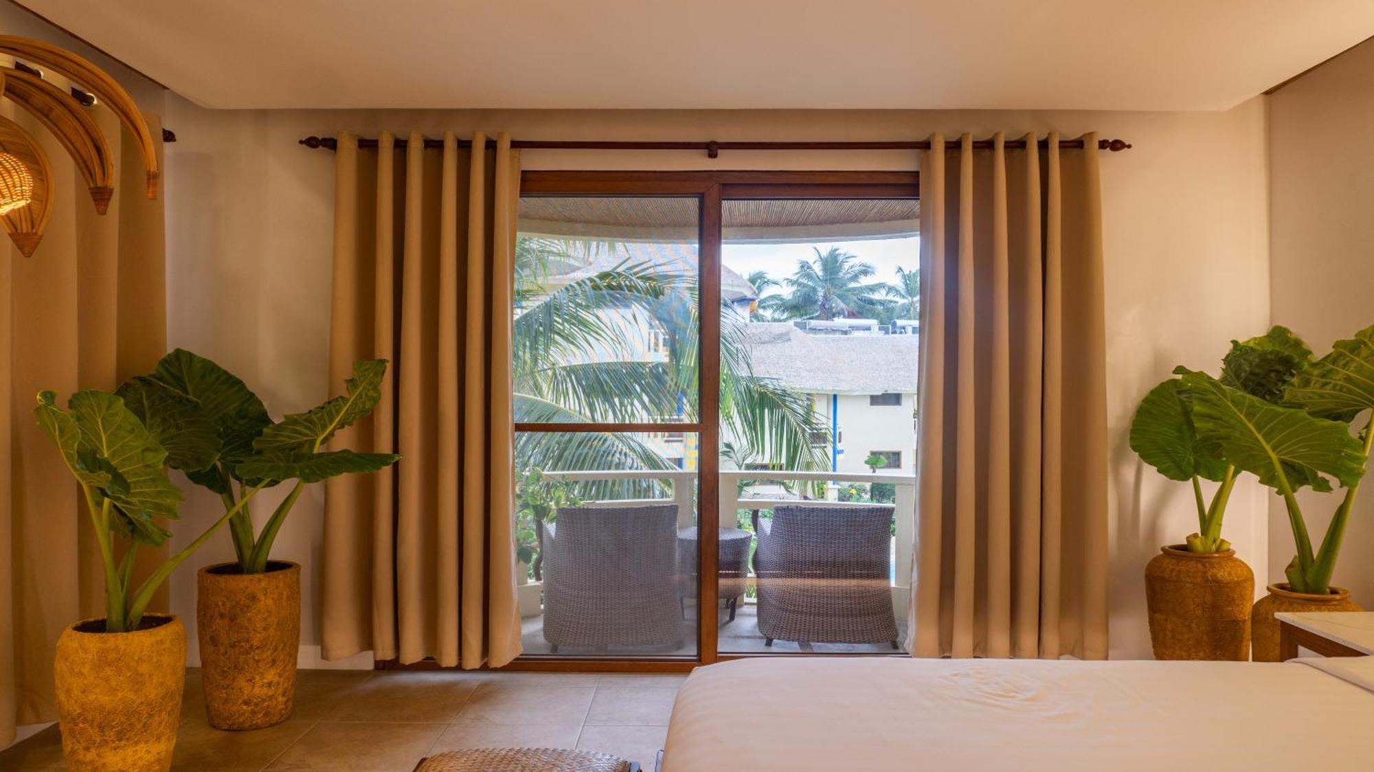 Ambassador In Paradise Balabag  Exterior photo A sliding door